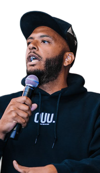 Carlas 'CJ' Quinney Jr. speaking with a microphone